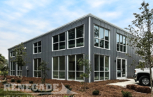 Commercial steel building office with windows and doors gray