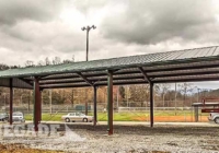 steel building with open walls used for batting cages
