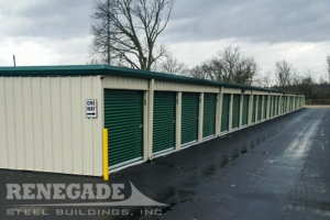 mini self storage steel building with green trim, roll up doors, 8 units
