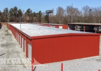 red steel metal mini self storage building with 18 units per side