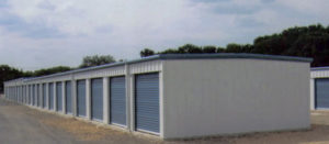 self storage mini steel metal building with step down, white with blue doors and trim