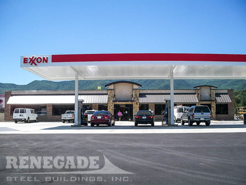 Retail steel building gas station, exxon, tan with rock wainscot, storefront glass and doors