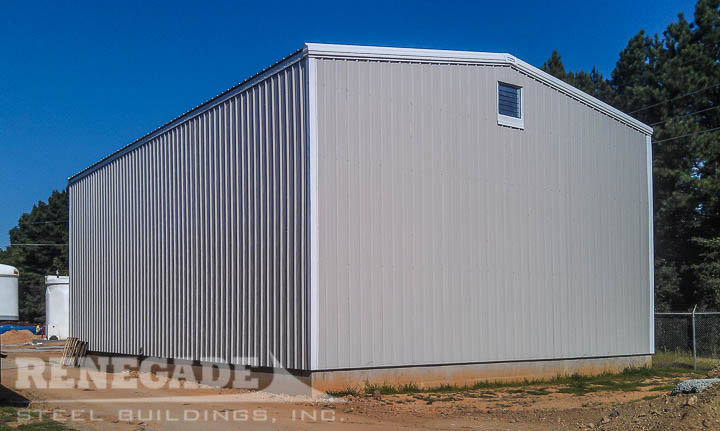 gray steel building with white trim, large openings, water treatment