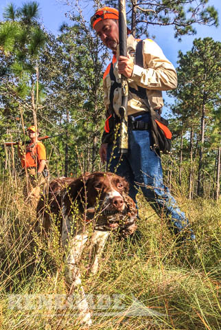 Dog with quail and hunter at Southwind Plantation Renegade Steel Buildings