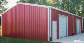 red steel metal building with white trim