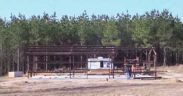 metal building being erected frame only