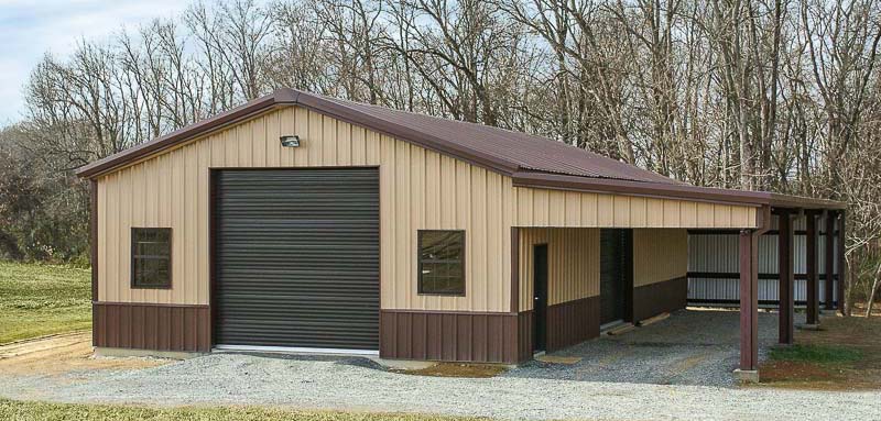 Tan and brown steel building with lean to