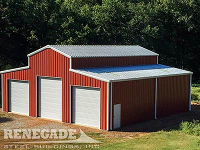 Red barn style steel building with large roll up doors