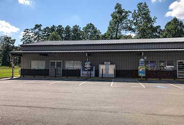 Strip mall steel building with wainscot and awning