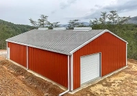 Renegade Steel Building with red wall panels and white trim