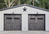 Gray and Black 30x50 steel building with barn style doors