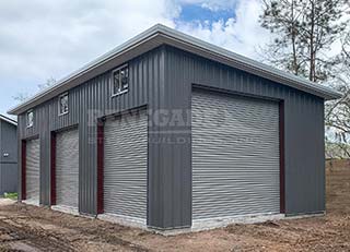 Renegade Steel Buildings - gray with gray trim and large roll up doors, single slope