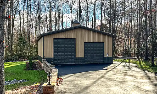 40x60 Renegade steel building with Tan walls and Burnished Slate trim, wainscot and overhangs.  Includes 2 4x4 cupolas.