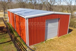 35x70x16.5 Renegade Steel Building with red walls, white trim and large roll up doors