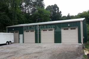 40x60x14 Renegade Steel Building with green walls and white trim, 4 openings for panel style doors