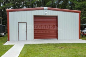 30x50x12 Renegade Steel Building with white walls and red trim and red roll up door
