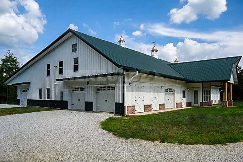 steel building barn look with portico, brick wainscot, canopies, barn doors,