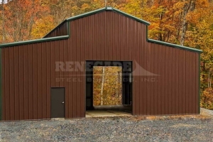 50x50x16.5 Monitor style Renegade Steel Building with brown walls, green trim and rollup doors on each end.