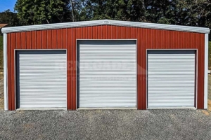40x50x16 Renegade Steel Building with red walls and white trim, 3 large roll up doors