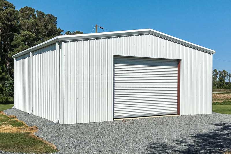 30x30x12 white steel building with white trim and roll up door