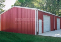 30x50x12 Renegade Steel Building with red walls, white trim, large rollups and walk door