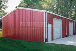 30x50x12 Renegade Steel Building with red walls, white trim, large rollups and walk door