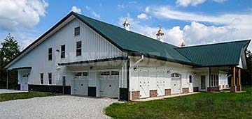 Barndominium with hip roof, canopies, eave extensions, and wainscot