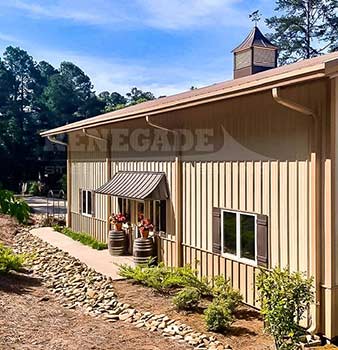 steel building barndominium with wainscot and eave extensions