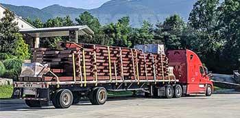 Steel building loaded on a flatbed truck