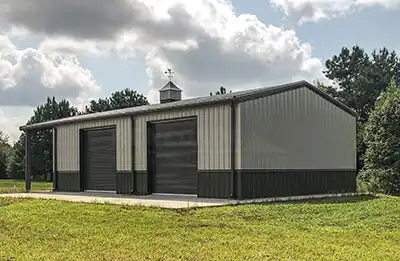 30x65 Renegade steel building with open bay, gray walls, burnished slate wainscot and trim.
