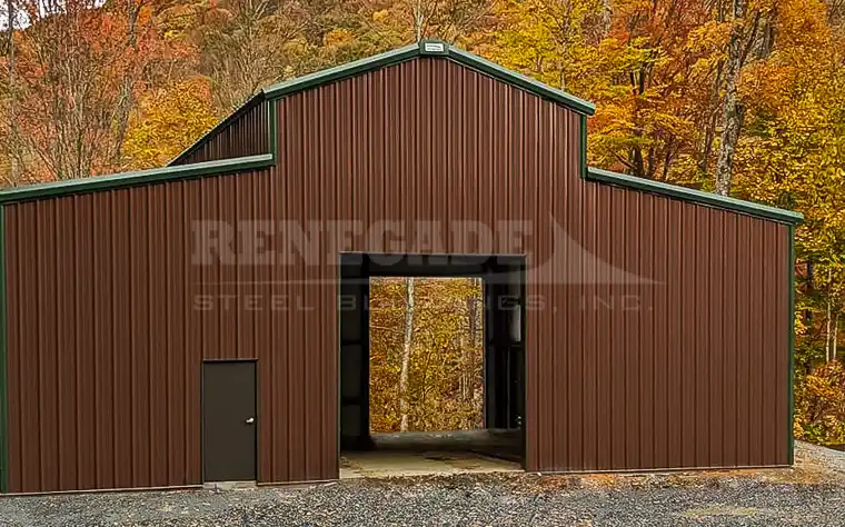 Renegade Steel Building, monitor style roof, brown walls with green trim