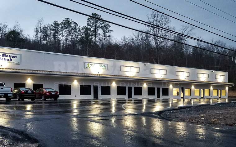 Strip mall style Renegade Steel Building with canopy and storefront glass and doors.