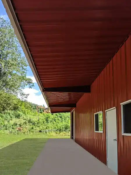 renegade steel building with canopy, red walls and soffit