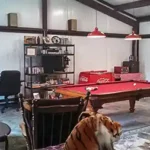 steel building man cave interior with pool table