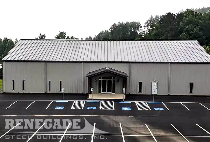 Steel building used for a church. Gray walls with burnished slate trim, also includes a drive under portico.