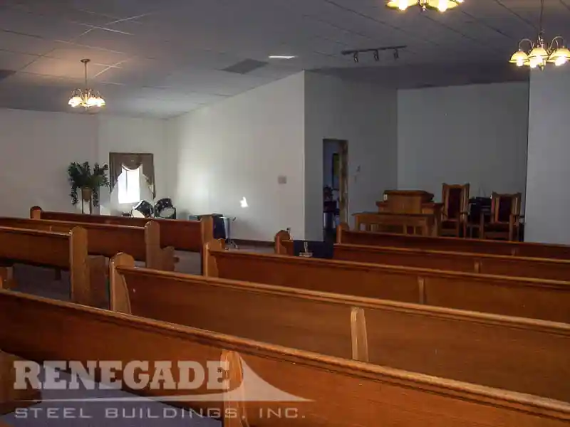 Steel building church interior showing church pews and alter