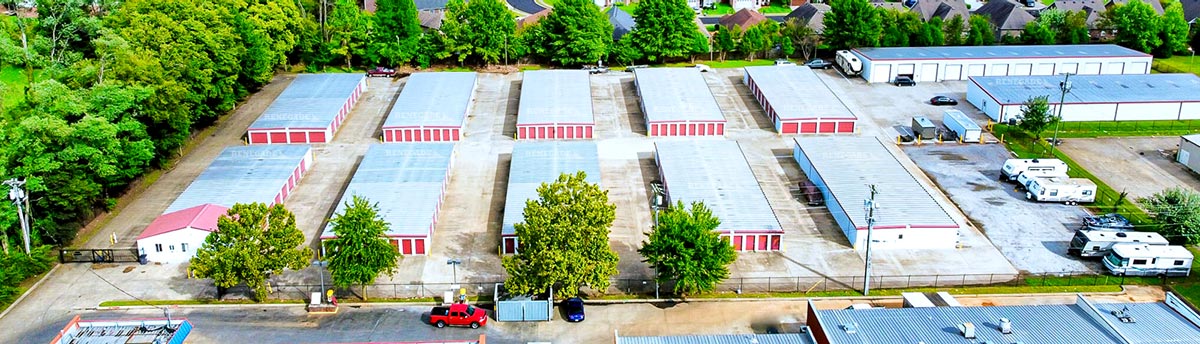 Self storage facility featuring buildings from Renegade. White walls with red trim and doors with a variety of unit mixes.