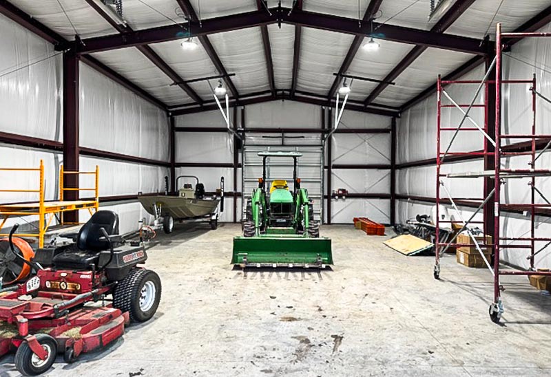 Inside of Steel building showing agricultural equipment storage