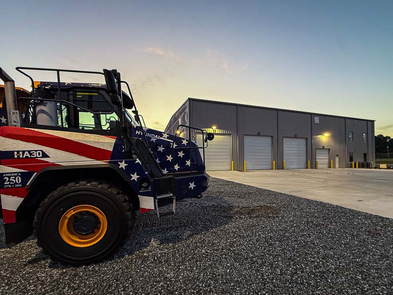 Truck and 80x135x33 commercial steel building