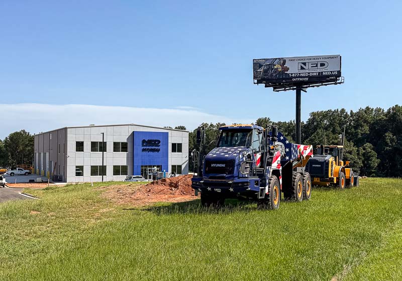 80x135x33 steel building with dump truck and dozer in front