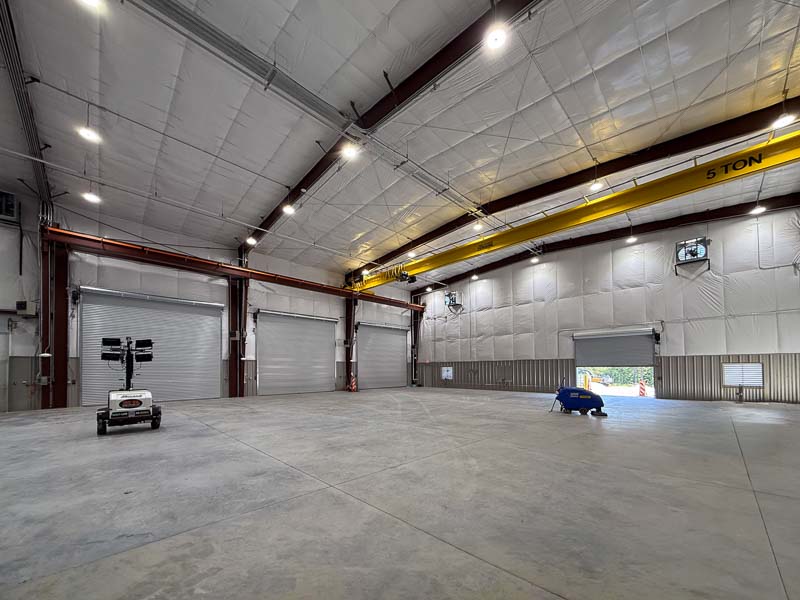 Shop area of 80x135x33 steel building featuring a 5-ton crane, liner system insulation and interior liner panels to 8'